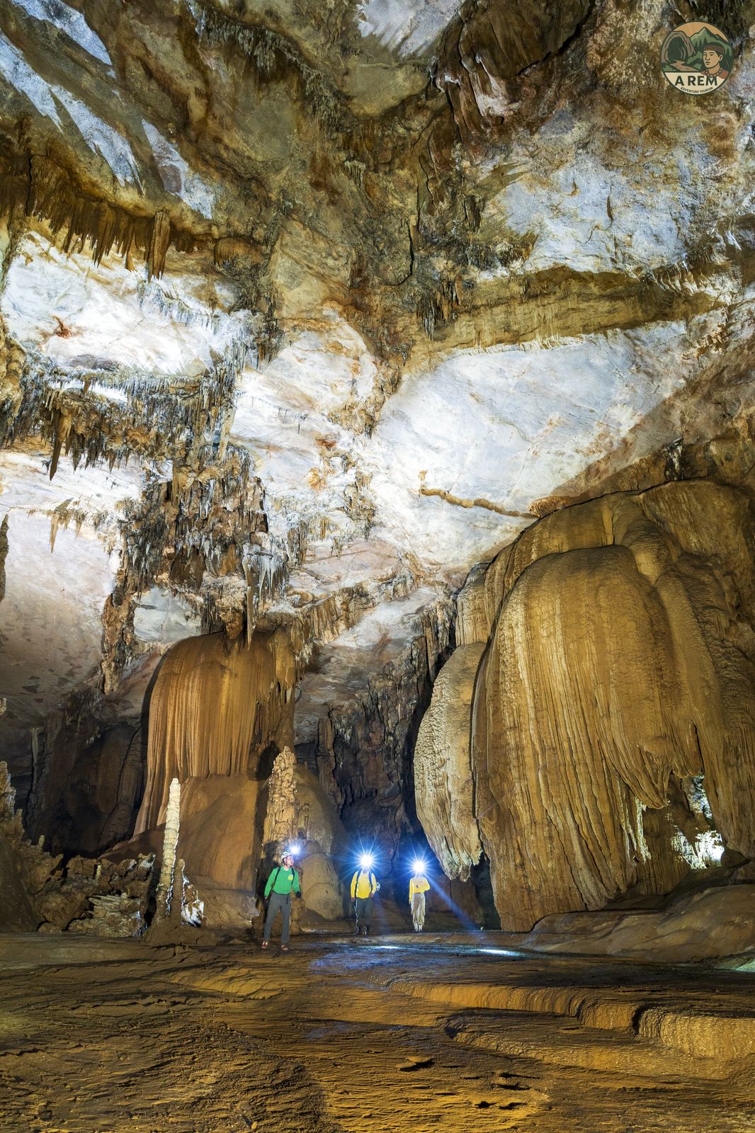 Epic cave chamber with light beam streaming from the ceiling