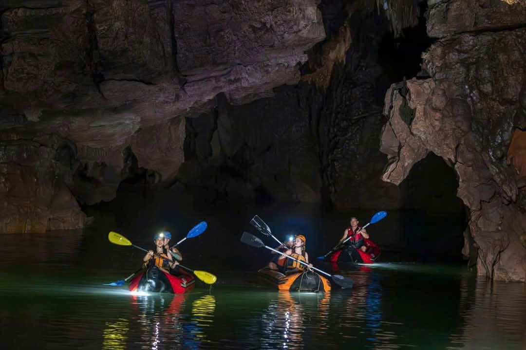Group kayaking deep inside Phong Nha Cave