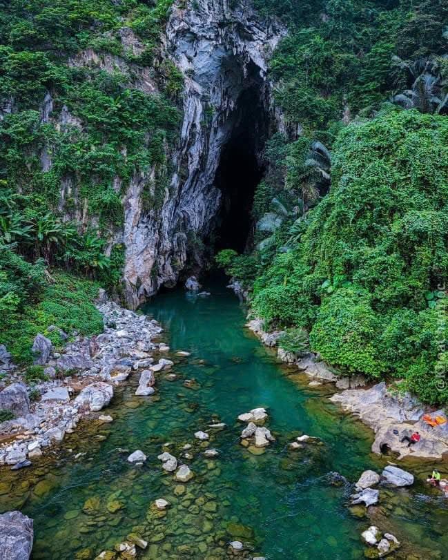Ruc Mon cave entrance with turquoise river, Phong Nha tour